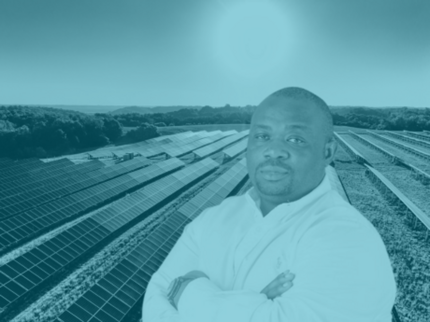 Mojola in front of solar panels
