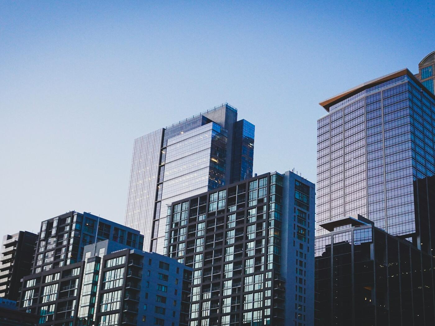 Photo of skycrapers against a clear blue sky