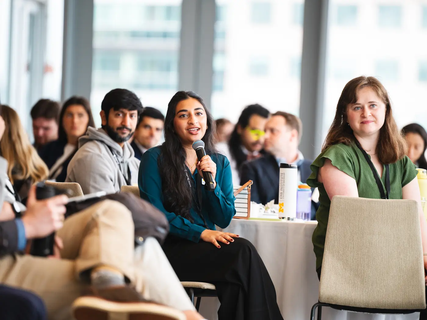 ClimateCAP attendee holding microphone in audience
