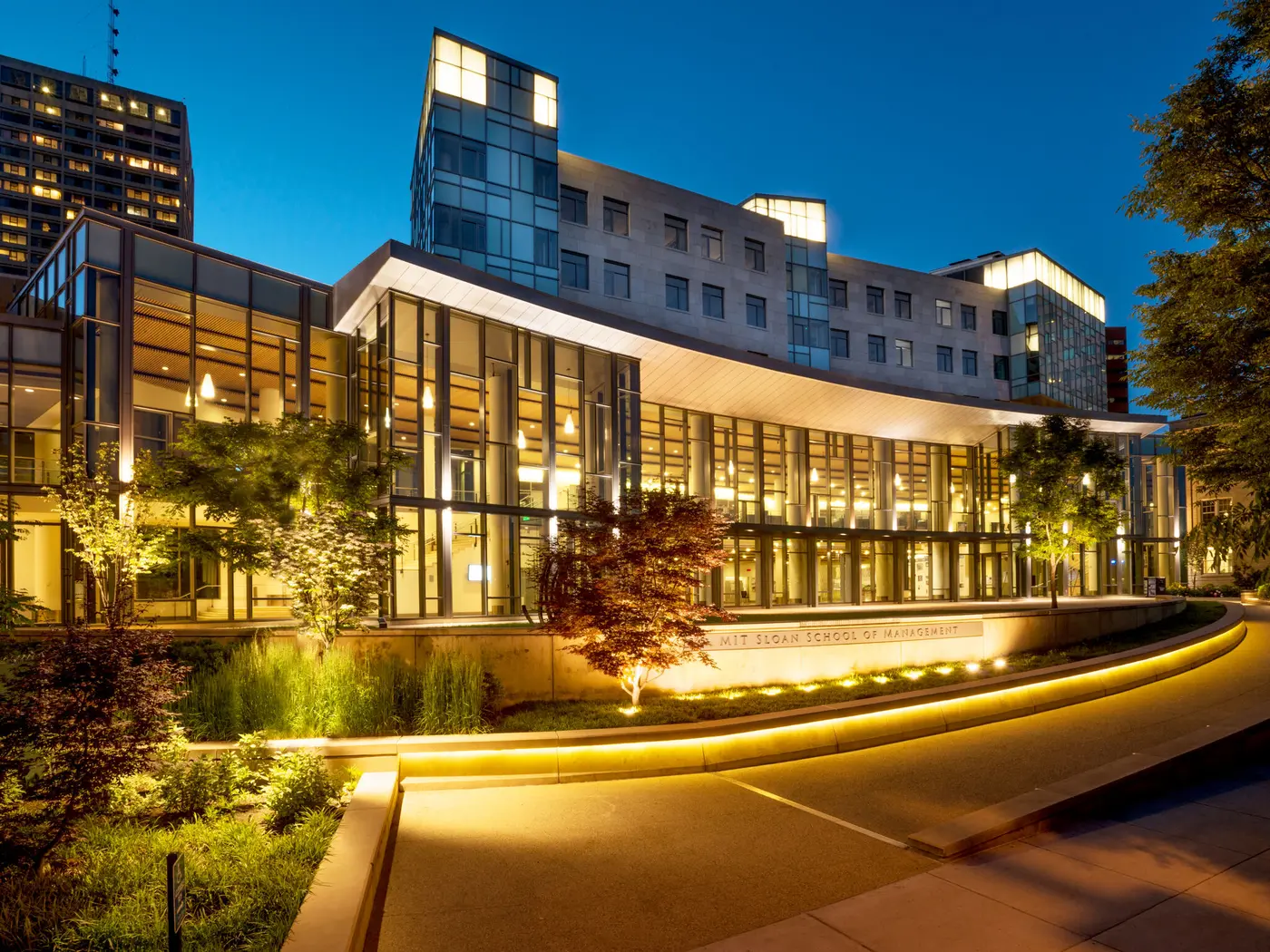 River side of MIT Sloan Building E62 at dusk