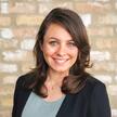 Photo of Alexa Katz, a caucasian woman with medium length brown hair smiling 