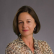 Headshot of woman looking directly to camera