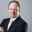 Headshot of MIT Sloan Professor Christopher Knittel, Faculty Director of the MIT Climate Policy Center