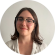 Hadley Timmermann wearing tan blazer and glasses headshot