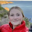 Close up smiling photo of a woman taken outdoors