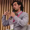 Matias Bertranou speaking into a microphone