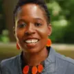 Woman with short black hair smiling