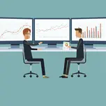 two people talking in front of three computer screens