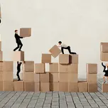business workers stacking blocks in cooperation