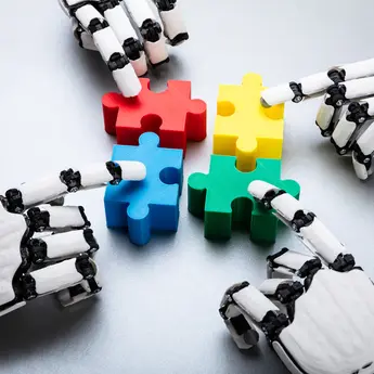 robot hands touch colorful puzzle pieces