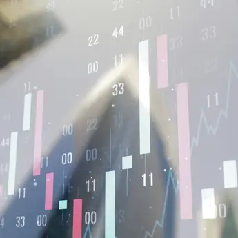 Numbers over city skyline