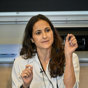 Woman speaks to audience in classroom