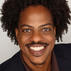 Close-up photo of smiling man