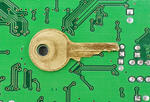 key on top of an early circuit board