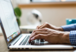 Person with Mac laptop