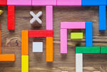 An illustration of a maze created out of building blocks from a child's playset.