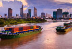 cargo boats and cityscape