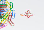 Paperclip transforms into airplane.