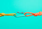 An illustration of a carabiner connecting two ropes, symbolizing the important connections that hold people together at work, especially during the COVID-19 pandemic.