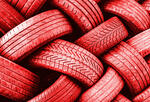 A close-up of a tangle of red tires creating an interesting pattern