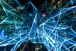Time lapse of cables in front of city representing data flowing through economy.