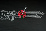 Graphic of a chalkboard drawing of a dart hitting a bullseye.