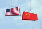 Image of shipping containers with Chinese and American flags