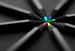 black pencils with colored points meet in a pinwheel