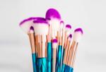 a group of violet-tipped paint brushes