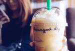Picture of an iced coffee beverage with "have a good day" written on it.