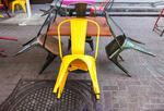 Colorful empty chairs at an outdoor restaurant