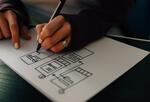 Photo of hand drawing wireframe on paper