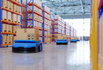 image of robots on a factory floor as part of an automated supply chain