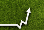 Up arrow on top of a bed of grass
